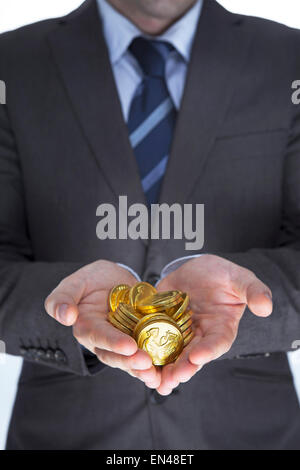 Business man holding ori nelle mani. Finanza voncept Foto Stock