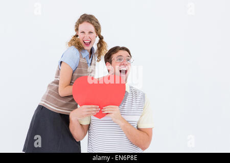 Emozionato geeky hipster coppia con cuore card Foto Stock