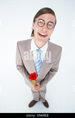 Geeky lovesick hipster holding rose Foto Stock