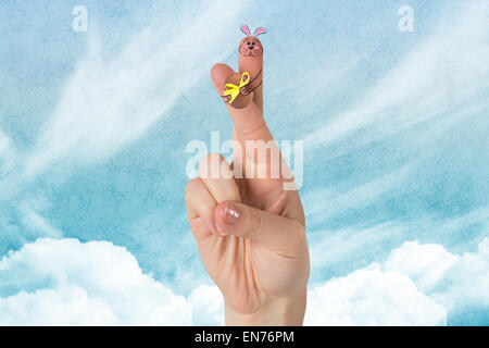 Immagine composita di dita come coniglietto di pasqua Foto Stock