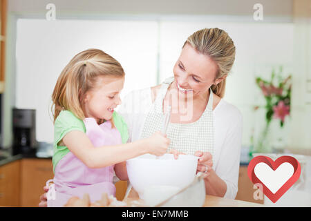 Immagine composita della madre e figlia divertirsi in cucina Foto Stock
