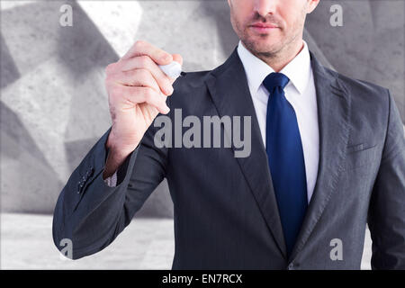 Immagine composita di grave imprenditore iscritto con marcatore Foto Stock