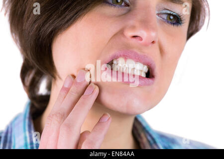 Bella bruna con un mal di denti Foto Stock