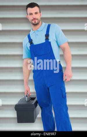 Immagine composita di aggiustatore con toolbox Foto Stock