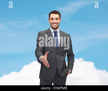 Imprenditore con mano aperta pronta per stretta di mano Foto Stock