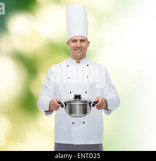Maschio felice chef di cucina azienda pot Foto Stock