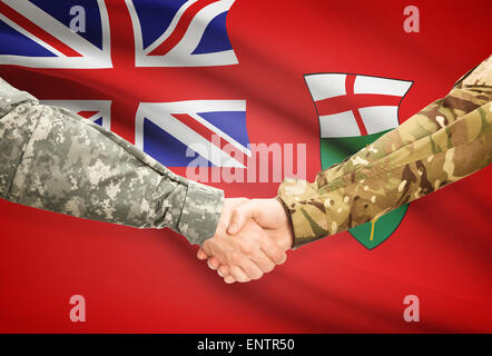 Soldati e handshake provincia canadese bandiera - Ontario Foto Stock