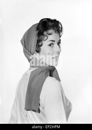 Abbigliamento: moda: Collant: donna che indossa red paio di collant come hat. Modello: Barbara Pinney. Gennaio 1959 Foto Stock