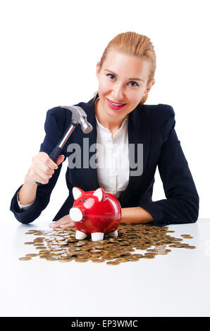 La donna la rottura salvadanaio per il risparmio Foto Stock