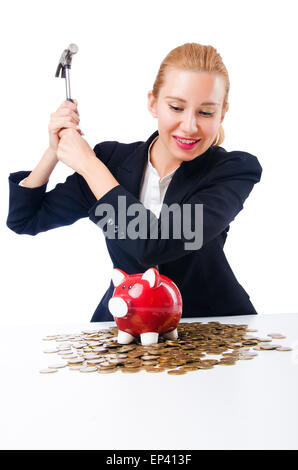 La donna la rottura salvadanaio per il risparmio Foto Stock