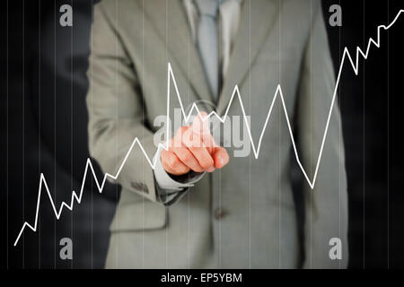 Dito Businessmans curva di attivazione sul touch screen Foto Stock