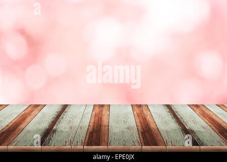 Abstract rosa sfumato con sfondo bokeh e pavimento in legno Foto Stock
