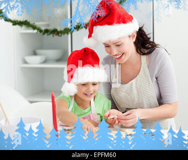 Madre e figlia la preparazione di biscotti di Natale Foto Stock