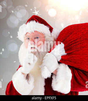 Immagine composita di santa claus che trasportano il sacco Foto Stock