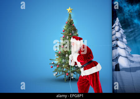 Immagine composita di santa claus tirando la corda Foto Stock