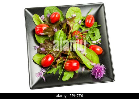 Insalata mista di foglie e di pomodori Foto Stock