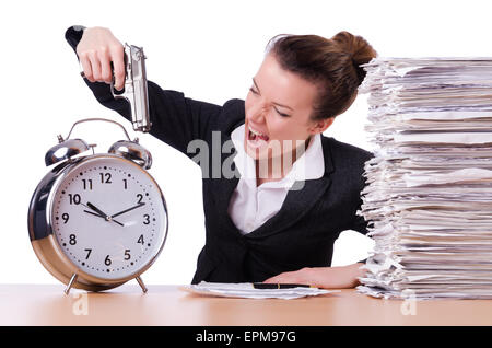 Donna con la pistola sotto stress da scadenze Foto Stock