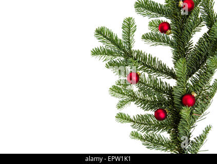 Piccolo vetro rosso palle di Natale su un ramo di abete Foto Stock