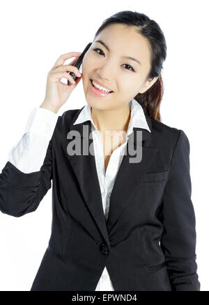 Attraente ragazza asiatica nel suo ventenne isolato su un sfondo plein girato in uno studio Foto Stock