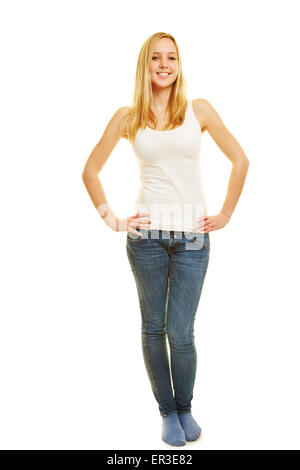 Vista frontale di slim donna bionda con le braccia akimbo come corpo pieno shot Foto Stock