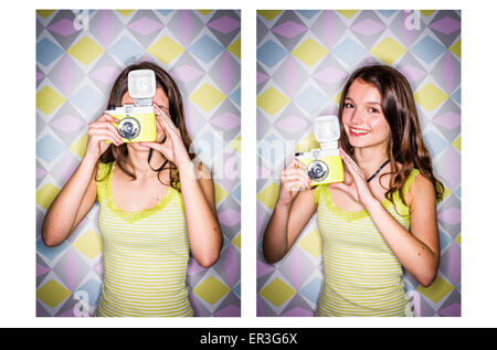 Ragazza adolescente utilizzando una telecamera. Foto Stock