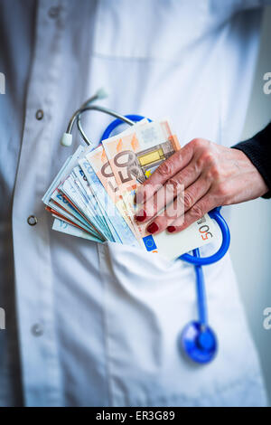 Medico e di denaro. Foto Stock