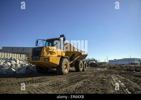 Grandi camion al sito in costruzione Foto Stock