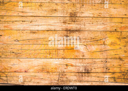 Giallo rustiche tavole di legno come Grunge sfondo graffiato, tonica immagine Foto Stock