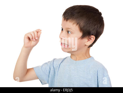 Ragazzo guarda al dente perduto Foto Stock