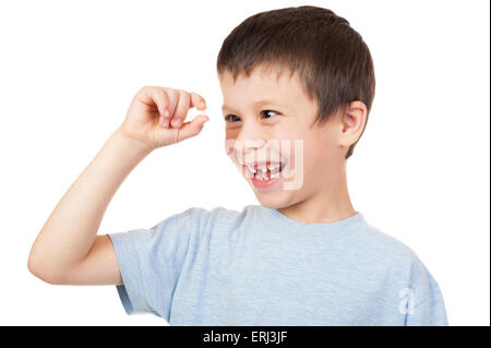 Ragazzo guarda al dente perduto Foto Stock