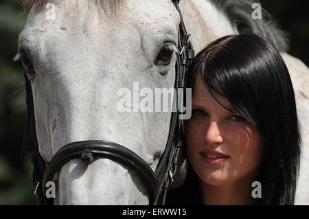 Donna e warmblood Foto Stock