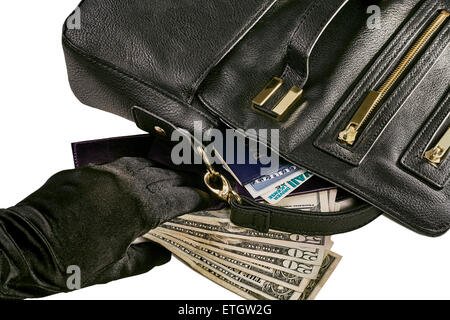 Immagine di una mano guantata reacing per denaro e un portafoglio rivelando un passaporto, tessera di previdenza sociale e la patente con un nero Foto Stock
