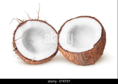 Due metà di noce di cocco che giace accanto isolati su sfondo bianco Foto Stock