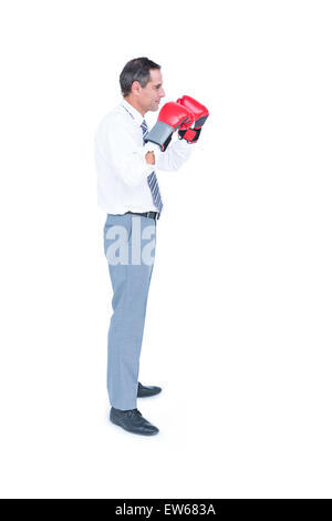Businessmans pugno in un guanto di boxe Foto Stock
