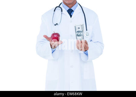 Medico di cassa di contenimento e mela rossa Foto Stock