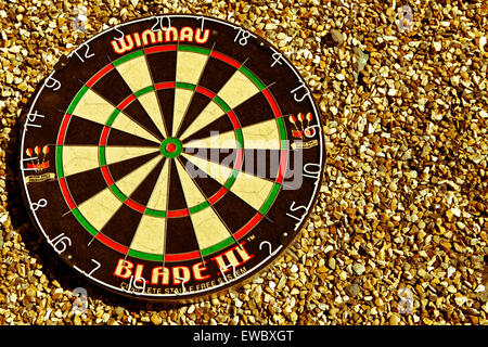 Dartboard su ciottoli Foto Stock