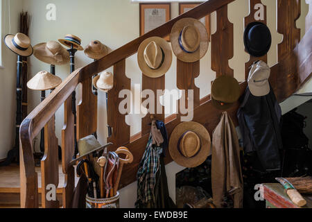 Raccolta di cappello da sole sulla scala Foto Stock