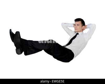 Isolate il business man posizione rilassante Foto Stock