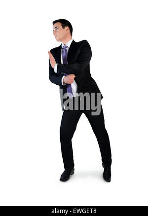 Isolate il business man spingere qualcosa Foto Stock