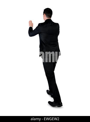 Isolate il business man spingere qualcosa Foto Stock