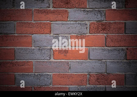 Rosso e grigio a muro in mattoni con vignette. Utile come sfondo o uno sfondo Foto Stock
