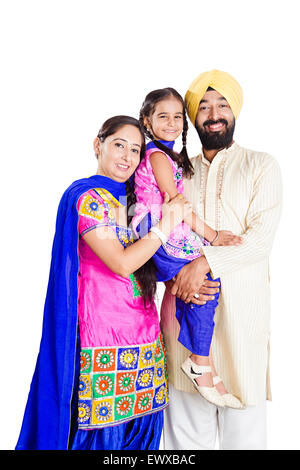 Indian Punjabi genitori e figlia di cura Foto Stock