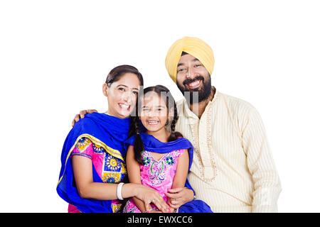 Indian Punjabi genitori e figlia di cura Foto Stock