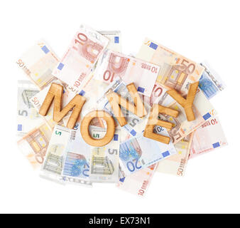 Parola denaro al di sopra del mucchio di denaro Foto Stock