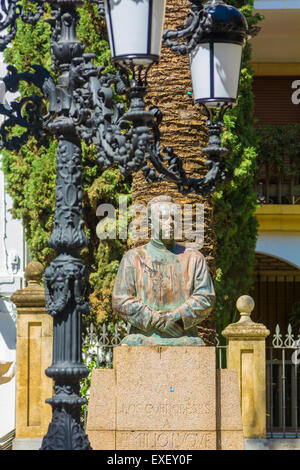 Lampada di antiquariato con letti in ferro battuto con ornamenti Foto Stock