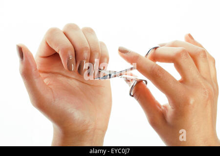 Donna mani rendendo no manicure qualificato per sé isolato Foto Stock