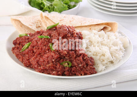 Paté di carne di montone cuocere con riso e CHAPATI Foto Stock