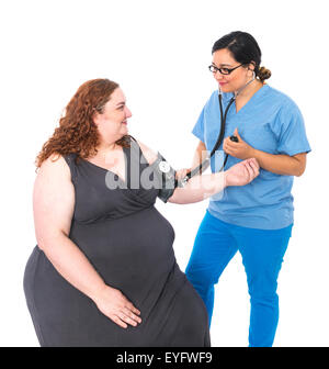 Urse in frega con paziente tenendo la pressione sanguigna Foto Stock