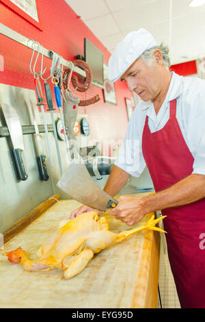 Giunzione di macellaio un pollo Foto Stock