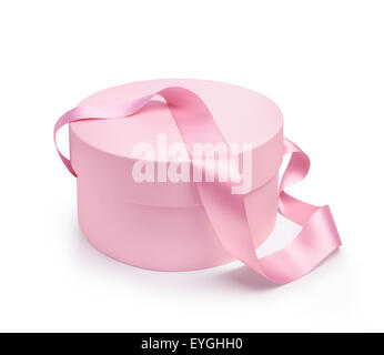 Dono forma rotonda scatola in colore rosa con nastro di maniglia. Isolato su sfondo bianco Foto Stock